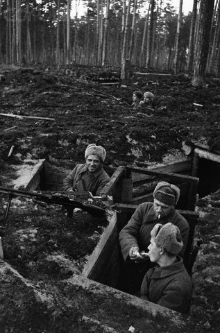 Soldiers in Foxhole Share a Smoke